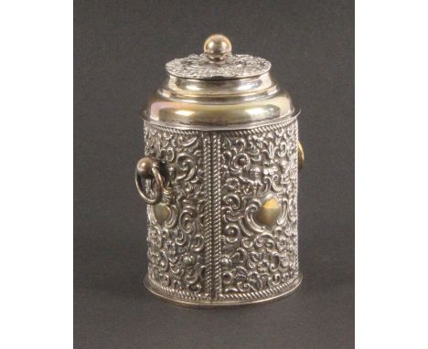 A silver tea caddy, of cylindrical form, with embossed panels and lid, 11cms high, Birmingham 1896.           