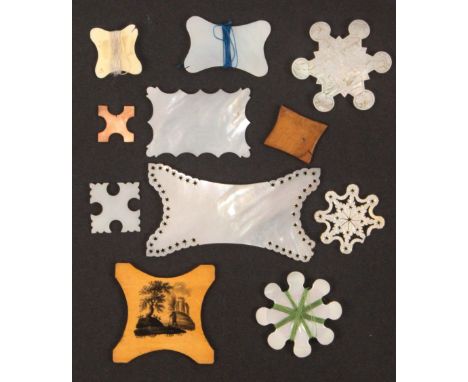 Eleven various thread winders, comprising a Chinese mother of pearl carved snowflake with figures, buildings and plants, 5cms