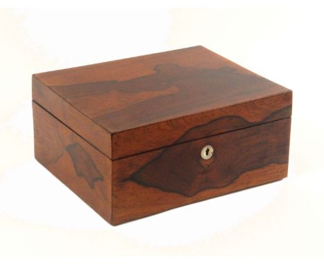 A mid 19th Century rosewood well fitted sewing box, of plain rectangular form veneered in boldly grained rosewood. The lid in