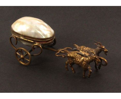 A mother of pearl pin or thimble cart, in the style of Palais Royal, the mother of pearl egg form hinged container raised on 