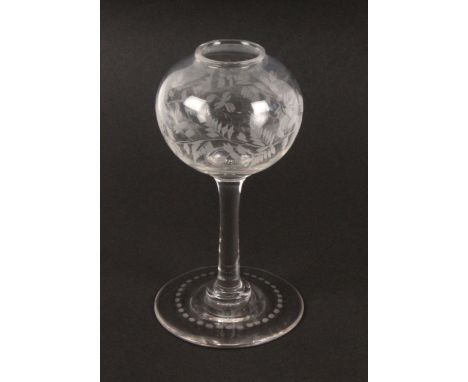 A 19th Century lace maker's glass lamp of small proportions, the bowl etched with a band of trailing leaves, the plain stem t