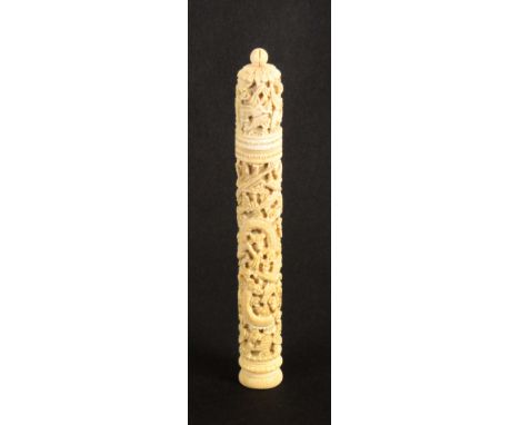 An early 19th Century carved ivory Chinese cylinder netting case, carved with dragon, birds, butterflies, etc., and with a ra