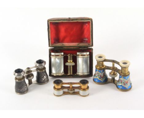 Four pairs of late 19th/early 20th Century opera glasses, comprising a gilt frame pair with elaborate floral and bird enamell