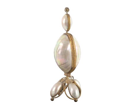 An elaborate mother of pearl and gilt mounted sewing companion in the style of Palais Royal, circa 1870, the gilt metal base 