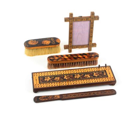 Tunbridge ware - five pieces, comprising a floral mosaic cribbage board raised on four ball feet, 25.5cms, an Oxford style pi