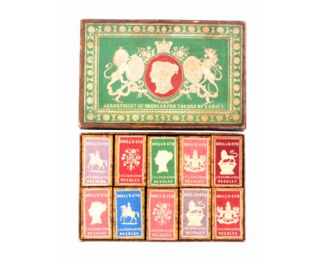 A scarce boxed set of ten cardboard needle packet boxes, the outer box with a green ground and white embossed label titled 'A