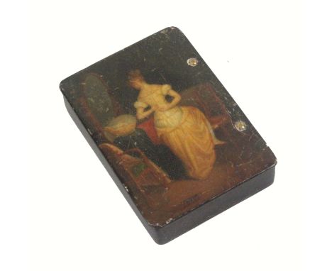 A mid 19th Century papier mache rectangular snuff box in the manner of Stobwasser, the lid painted with a lady in her boudoir