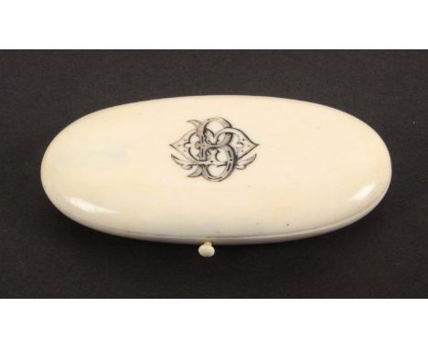 A late 19th Century French oval ivory etui, the lid monogramed BM?, the flush fitted interior with silver gilt engraved tools