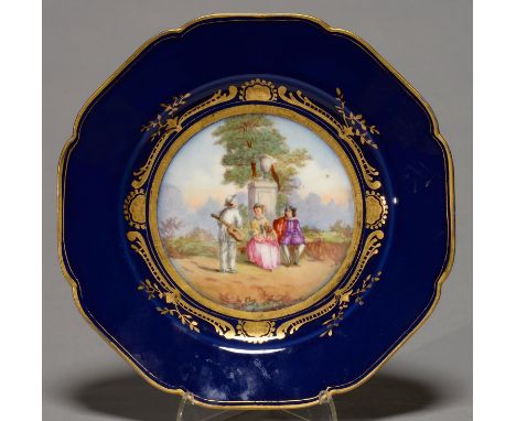 A FRENCH PORCELAIN CABINET PLATE DECORATED IN SEVRES STYLE, C1900, PAINTED WITH A WATTOESQUE SCENE RESERVED ON A&nbsp; ROYAL 