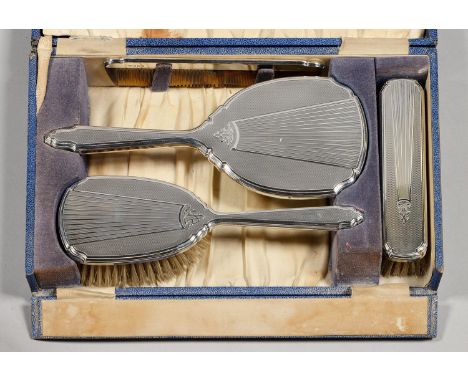 AN ELIZABETH II FOUR PIECE SILVER BRUSH SET, ENGINE TURNED, BY MAPPIN AND WEBB LIMITED, BIRMINGHAM 1960, CASED Back of hairbr