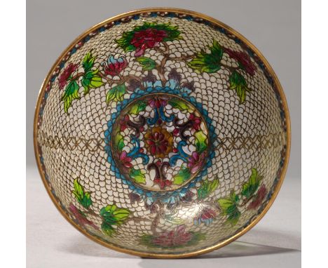 A JAPANESE PLIQUE A JOUR ENAMEL BOWL, FIRST HALF 20TH C, DECORATED WITH TREE PEONY AND MON ON A SCALE PATTERN GROUND, 11CM DI