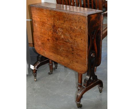 A VICTORIAN ROSEWOOD SUTHERLAND TABLE, C1880, ON BRASS CASTORS, 73CM H; 68 X 105CM Ring and other marks and stains on top, co