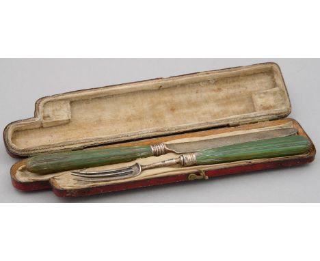 A GEORGE III GREEN STAINED IVORY HAFTED KNIFE AND FORK, C1784, KNIFE 15.5CM L, LION PASSANT AND INCUSE DUTY MARK ONLY, IN CON