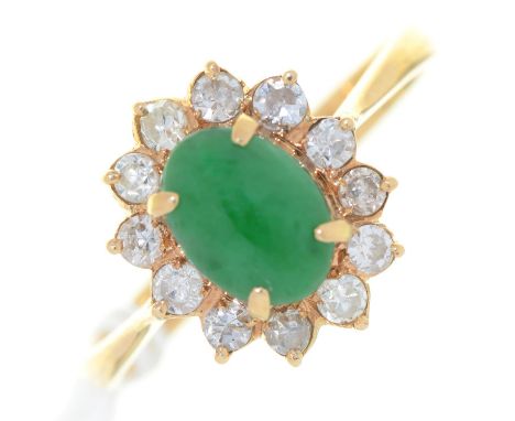 A JADE AND DIAMOND CLUSTER RING, WITH OVAL CABOCHON,&nbsp; IN GOLD MARKED 18K&nbsp; 585, 3.5G, SIZE P Good condition