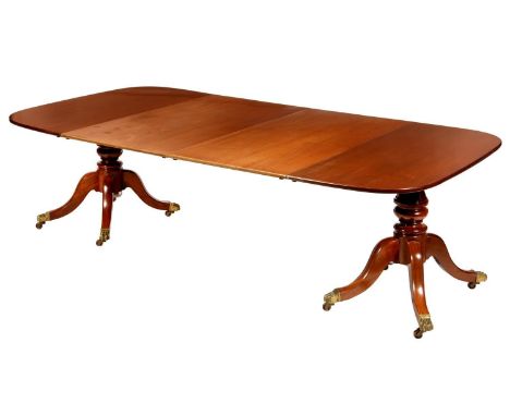 A TWIN PILLAR MAHOGANY DINING TABLE, 19TH C AND LATER, THE OBLONG TOP WITH TWO LEAVES, ON BULBOUS TURNED PILLARS AND QUADRUPL