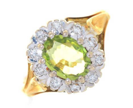 A PERIDOT AND DIAMOND CLUSTER RING, IN&nbsp; 18CT GOLD, LONDON 1972, 4G,&nbsp; SIZE K Good condition