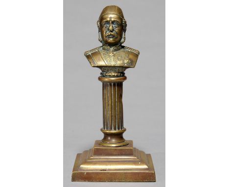 A VICTORIAN BRASS PORTRAIT BUST OF GENERAL GORDON OF KHARTOUM, C1880, ON REEDED PILLAR AND STEPPED SQUARE FOOT, 25CM H Pillar