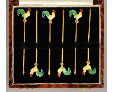 A SET OF SIX SILVER GILT AND ENAMEL COCKTAIL STICKS, C1930, WITH COCKEREL TERMINAL, 90MM, MARKED STERLING SILVER, 16DWTS, CAS