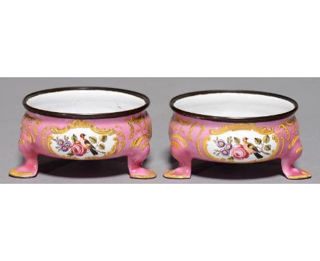 A PAIR OF 18TH C ENGLISH STYLE PAINTED ENAMEL SALT CELLARS, FRENCH, LATE 19TH C, THE THREE PANELS WITH SCENES OR FLOWERS, ON 