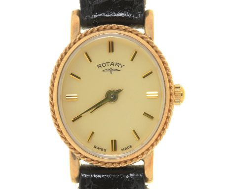 A ROTARY OVAL 9CT GOLD LADY'S WRISTWATCH, QUARTZ MOVEMENT, 20 X 17MM, ON A BLACK LEATHER STRAP Apparently good, Mellors &amp;