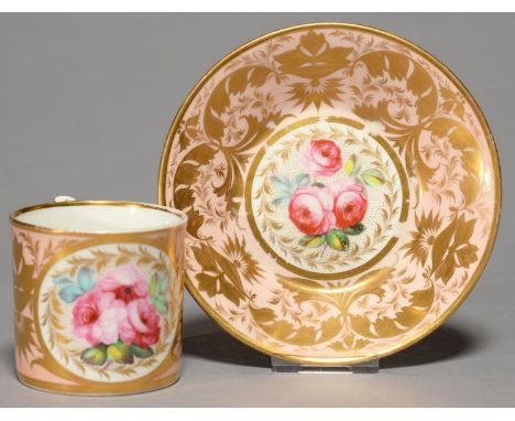 A DERBY COFFEE CAN AND SAUCER, C1820, WITH WISHBONE HANDLE, PAINTED WITH FULL BLOWN CABBAGE ROSES RESERVED ON A SALMON PINK G