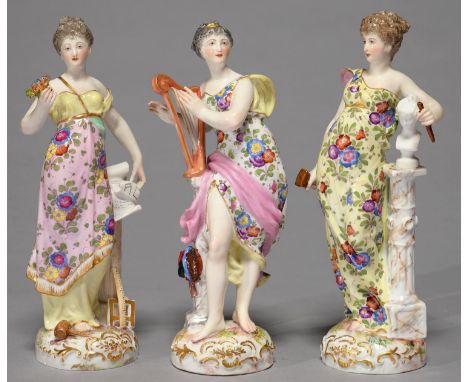 A SET OF THREE GERMAN PORCELAIN FIGURES OF MUSIC, GEOMETRY AND ART, LATE 19TH C, AS CLASSICAL MAIDENS BEARING DIFFERENT ATTRI