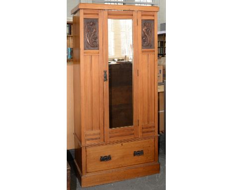 AN EDWARDIAN LIGHT WOOD WARDROBE WITH ART NOUVEAU CARVED TULIP PANELS AND ART METAL FURNITURE, 189CM H; 39 X 85CM Tiny knocks