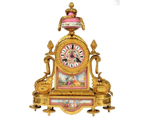 A FRENCH ORMOLU AND SEVRES STYLE PINK GROUND PORCELAIN MANTEL CLOCK, LATE 19TH C, IN LOUIS XVI STYLE, SURMOUNTED BY AN URN AN