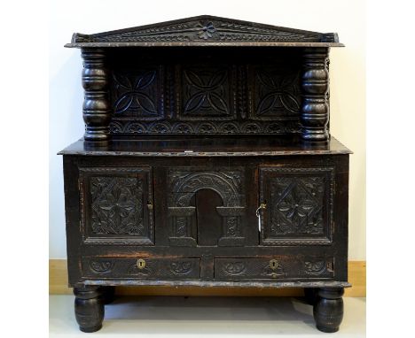 A VICTORIAN ANTIQUARIAN TASTE CARVED AND DARK STAINED OAK SIDEBOARD, LATE 19TH C, INCORPORATING EARLIER ELEMENTS, THE SHELF T