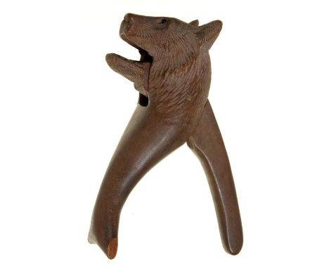 A SWISS BLACK FOREST BEAR NOVELTY CARVED LIMEWOOD LEVER NUT CRACKER, EARLY 20TH C, 16CM H Chip one end of front lever and one