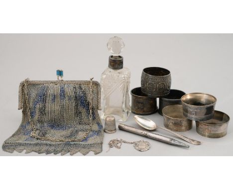 A SCOTTISH VICTORIAN EMBOSSED SILVER NAPKIN RING IN INDIAN STYLE, BY T SMITH AND SON, GLASGOW 1892, THREE AND A PAIR OF OTHER