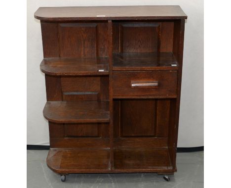 AN ART DECO OAK OPEN BOOKCASE, C1930, FITTED WITH A DRAWER, 88CM H; 23 X 69CM (ORIGINALLY PART OF A FITMENT) 