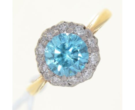 A BLUE ZIRCON AND DIAMOND CLUSTER RING, GOLD HOOP, INDISTINCTLY MARKED, 2.9G,&nbsp; &nbsp;SIZE K Good condition