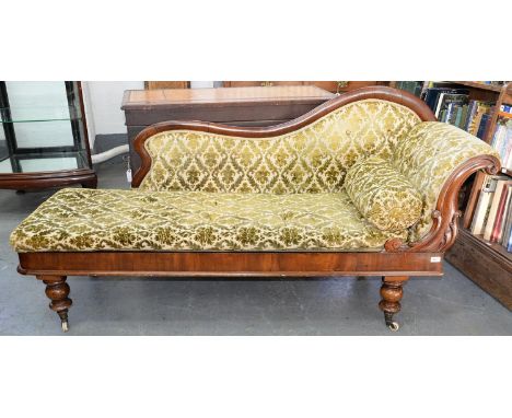 A VICTORIAN CARVED MAHOGANY CHAISE LONGUE, ON TURNED FEET AND POTTERY CASTORS, WITH BUTTONED CUSHION AND BOLSTER, 188CM L Bac