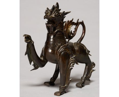 A SOUTH EAST ASIAN BRONZE AQUMANILE OF LION FORM, POSSIBLY 19TH C, THE HEAD FORMING THE COVER, 25CM H, LACKS HORNS Tail sligh