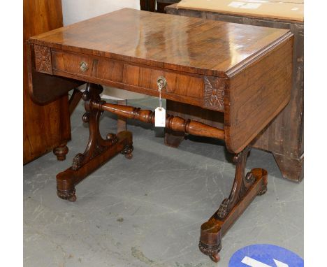 A WILLIAM IV ROSEWOOD SOFA TABLE, C1830, FITTED WITH TWO OPPOSING DRAWERS AND TWO BLIND DRAWERS BETWEEN LEAF CARVED TABLET, O