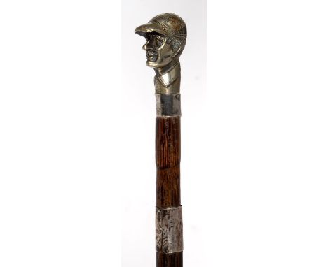 A BAMBOO WALKING CANE WITH AN EPNS JOCKEY'S HEAD POMMEL, LATE 19TH C, SILVER COLLAR, NICKEL PLATED TIP, 78.5CM Silver collars