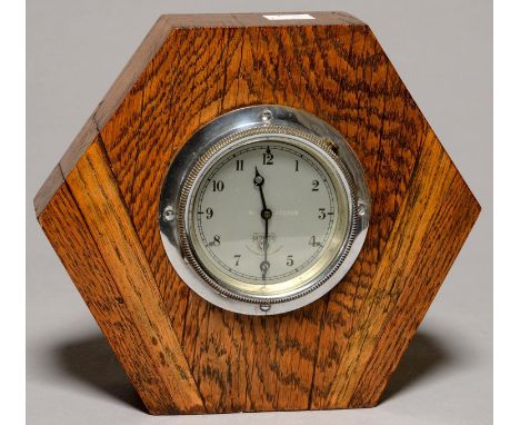 VINTAGE MOTORING. A SMITH'S MOTOR CAR DASHBOARD CLOCK, NUMBER 553929, CHROMIUM PLATED BEZEL, THE MOVEMENT IN BLACK PAINTED BR