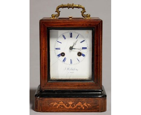 A FRENCH ROSEWOOD AND INLAID MANTEL CLOCK OF BALE SHAPE, C1860, WITH FOLIATE CAST BRASS LOOP HANDLE, THE ENAMEL DIAL INSCRIBE