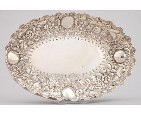 A VICTORIAN OVAL SILVER FRUIT DISH, DIE STAMPED AND CHASED WITH FLOWERS AND FOLIAGE ON A MATTED GROUND BENEATH CRIMPED RIM, 2