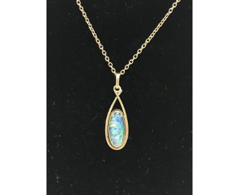 A 9ct opal doublet pendant and chain.