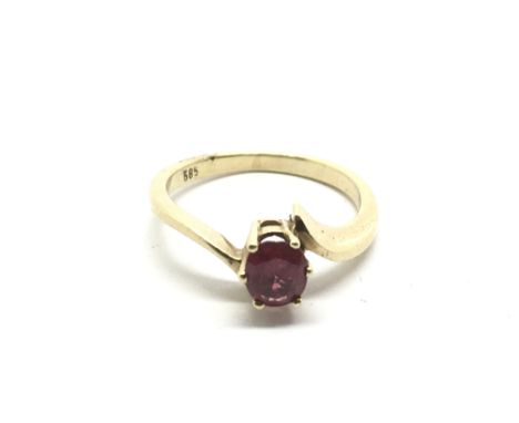 A gold ring marked 585 and set with a red coloured stone, approx 2.8g and approx size K-L.