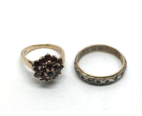 A 9ct gold ring set with garnets plus a full eternity ring, approx total weight 7g and approx sizes M-N and S-T.