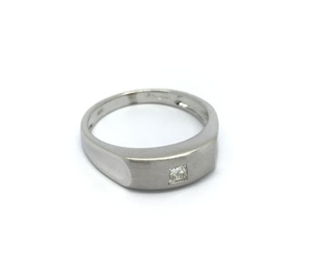 A modern design white gold solitaire ring set with a princess cut diamond. ring size N.