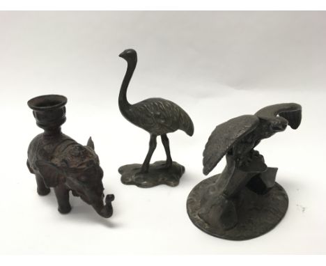 19th century bronzed elephant candlestick, figure of an ostrich and a figure of an Eagle on a rock with outstretched wings