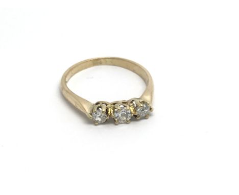 An 18carat gold ring set with three brilliant cut diamonds. ring size K