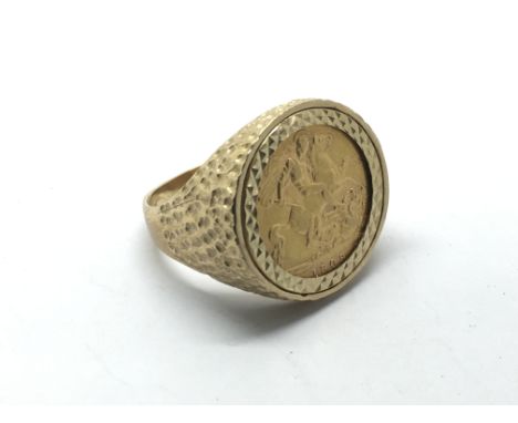 A 9ct gold ring inset with a 1909 half sovereign, approx 10.6g and approx size U.