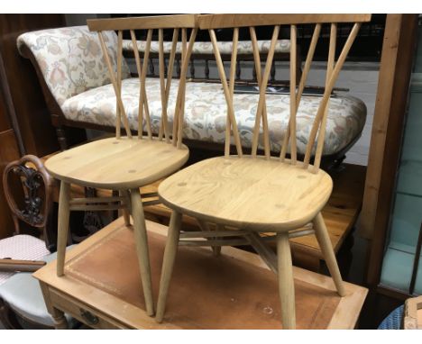 A pair of light wood Elm Ercol chairs with a matching bench with cross back supports (3)