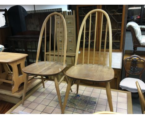 A set of Eight light Elm and beechwood Ercol dining chairs including two arm chairs (8)