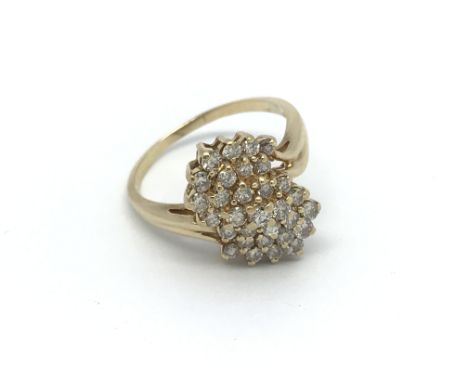 An 18ct yellow gold diamond cluster ring, approx 1ct diamonds, (R). 4.8g.